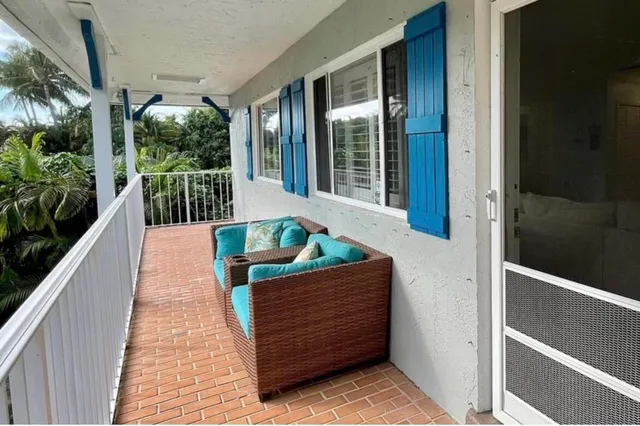 a view of balcony with furniture