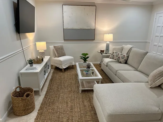 a living room with a couch and a flat screen tv