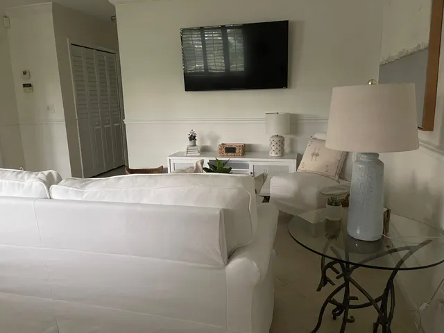 a living room with a couch and a flat screen tv