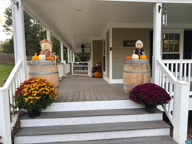 a view of living room kitchen and entryway