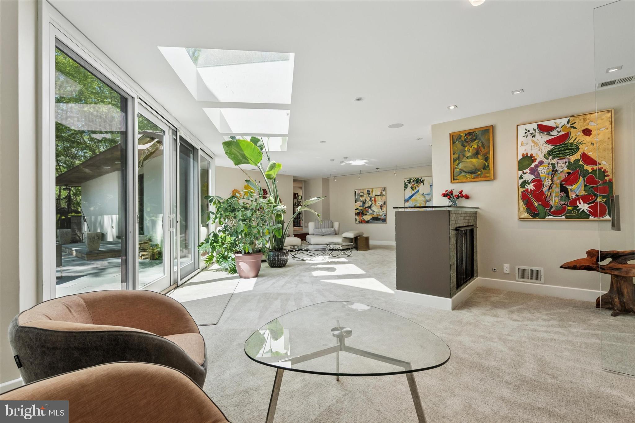 4126 Apalogen Road Philadelphia, PA 19129 - Photo 16 of 75 a living room with furniture a lamp and a potted plant