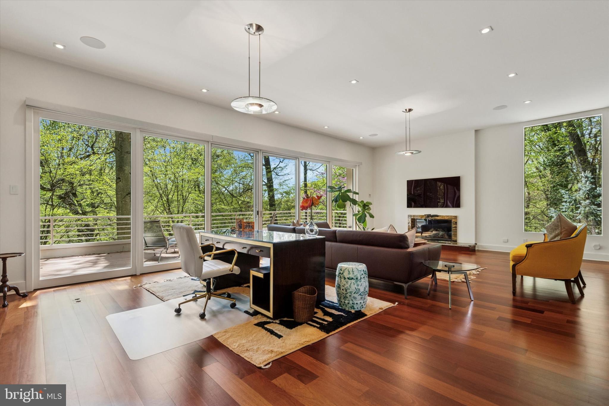 4126 Apalogen Road Philadelphia, PA 19129 - Photo 24 of 75 a living room with fireplace furniture and a large window