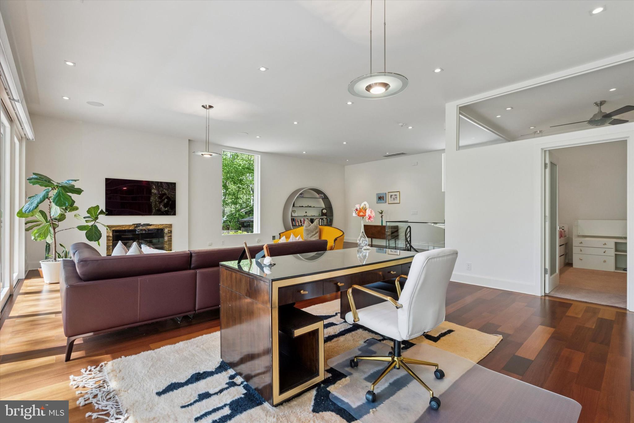 4126 Apalogen Road Philadelphia, PA 19129 - Photo 29 of 75 a living room with furniture and a flat screen tv