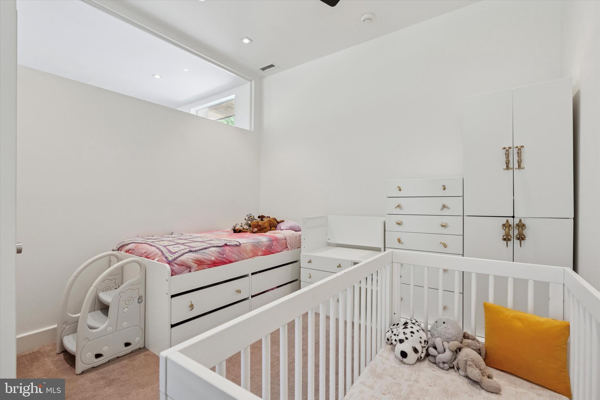 4126 Apalogen Road Philadelphia, PA 19129 - Photo 33 of 75 a bedroom with furniture and baby crib