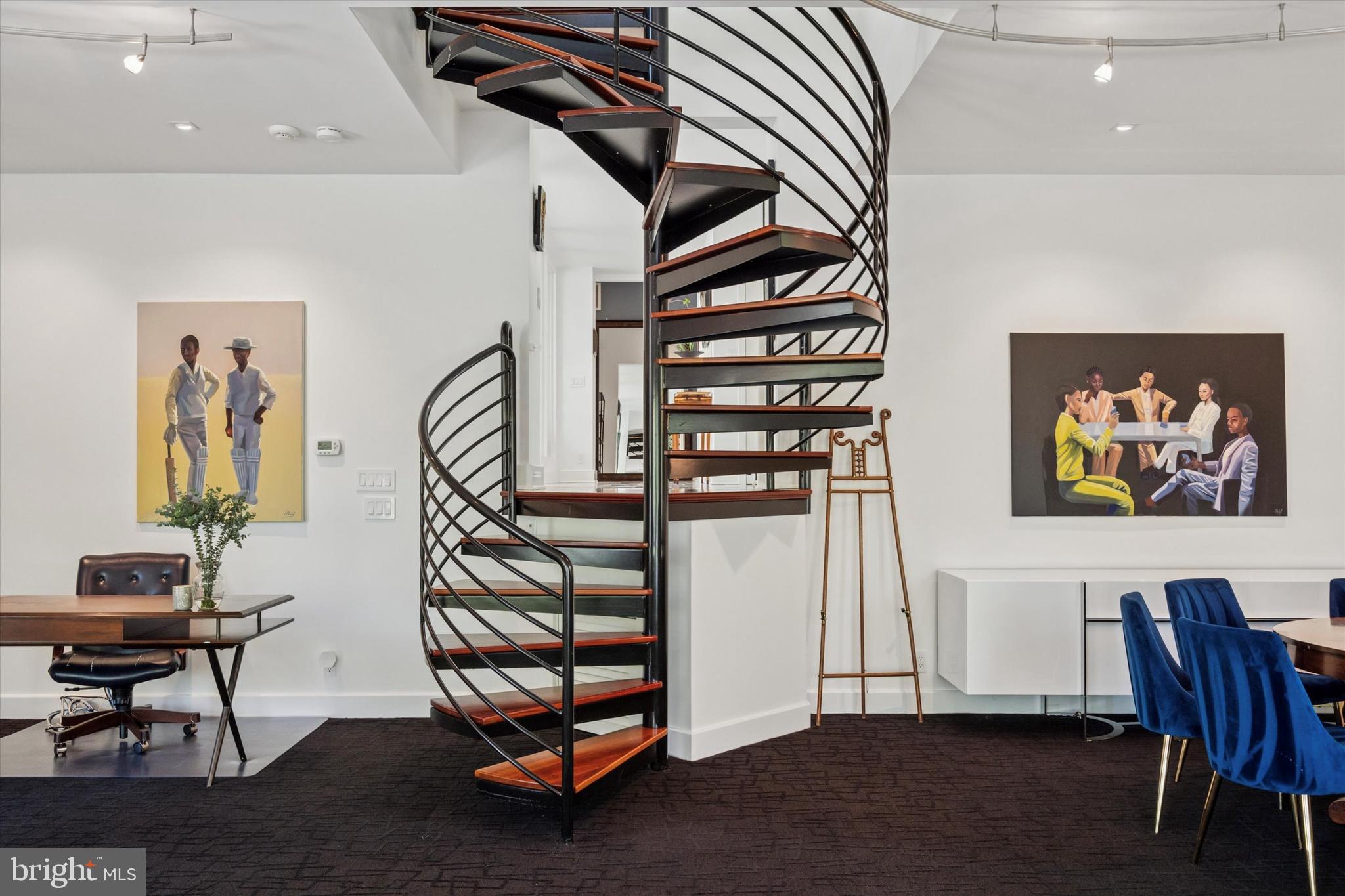 4126 Apalogen Road Philadelphia, PA 19129 - Photo 34 of 75 a view of a livingroom with furniture and stairs