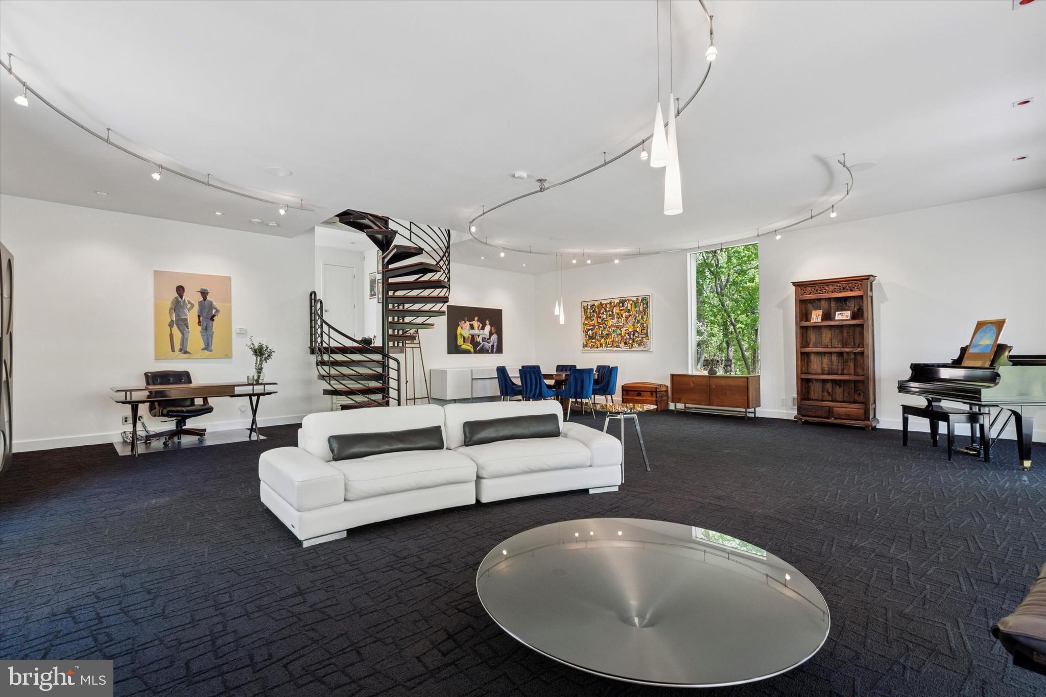 4126 Apalogen Road Philadelphia, PA 19129 - Photo 35 of 75 a living room with furniture and a table