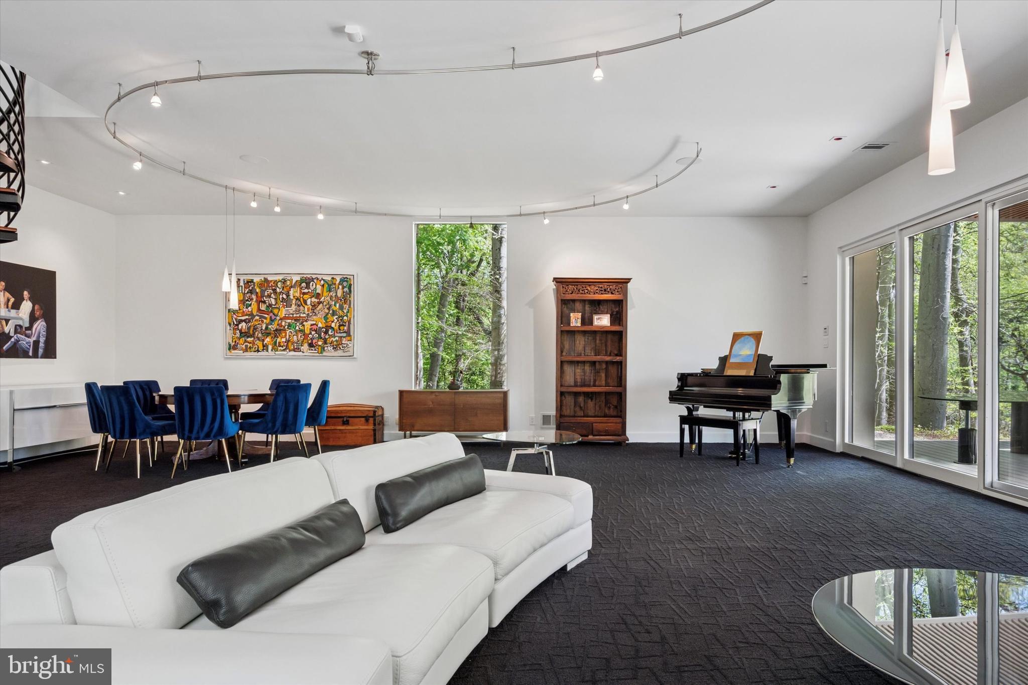 4126 Apalogen Road Philadelphia, PA 19129 - Photo 36 of 75 a living room with furniture and a wooden floor