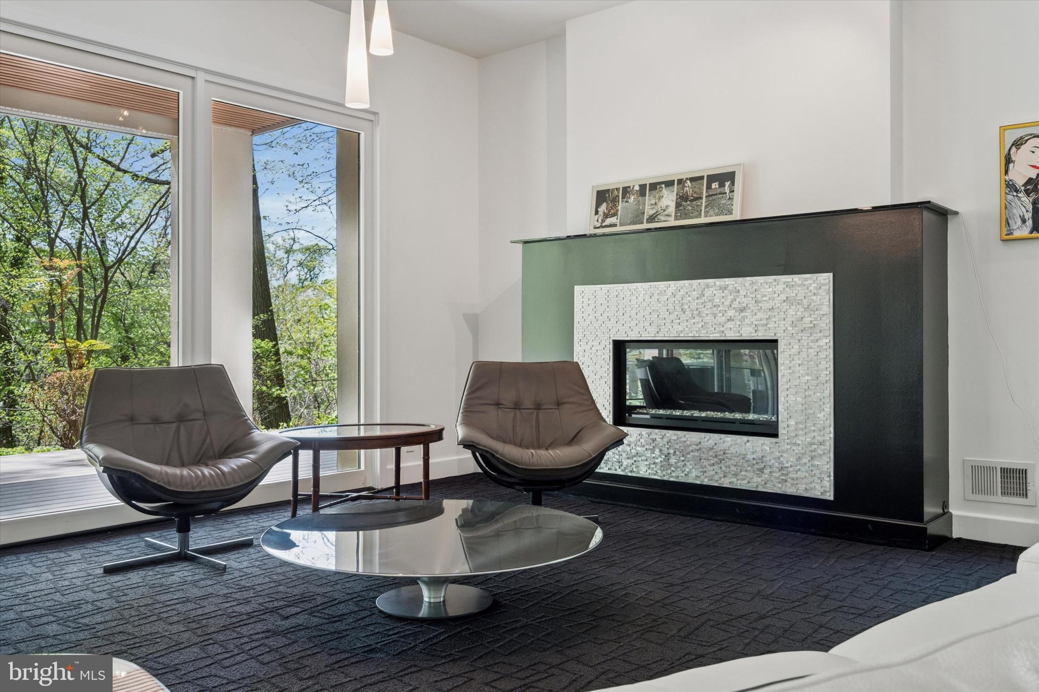 4126 Apalogen Road Philadelphia, PA 19129 - Photo 39 of 75 a living room with furniture and a fireplace