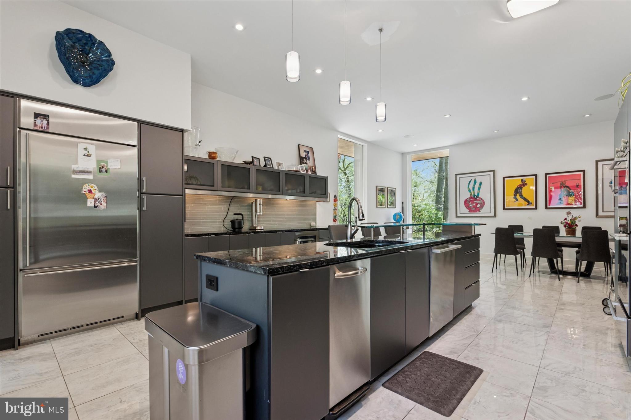 4126 Apalogen Road Philadelphia, PA 19129 - Photo 49 of 75 a kitchen with stainless steel appliances granite countertop a sink and a refrigerator