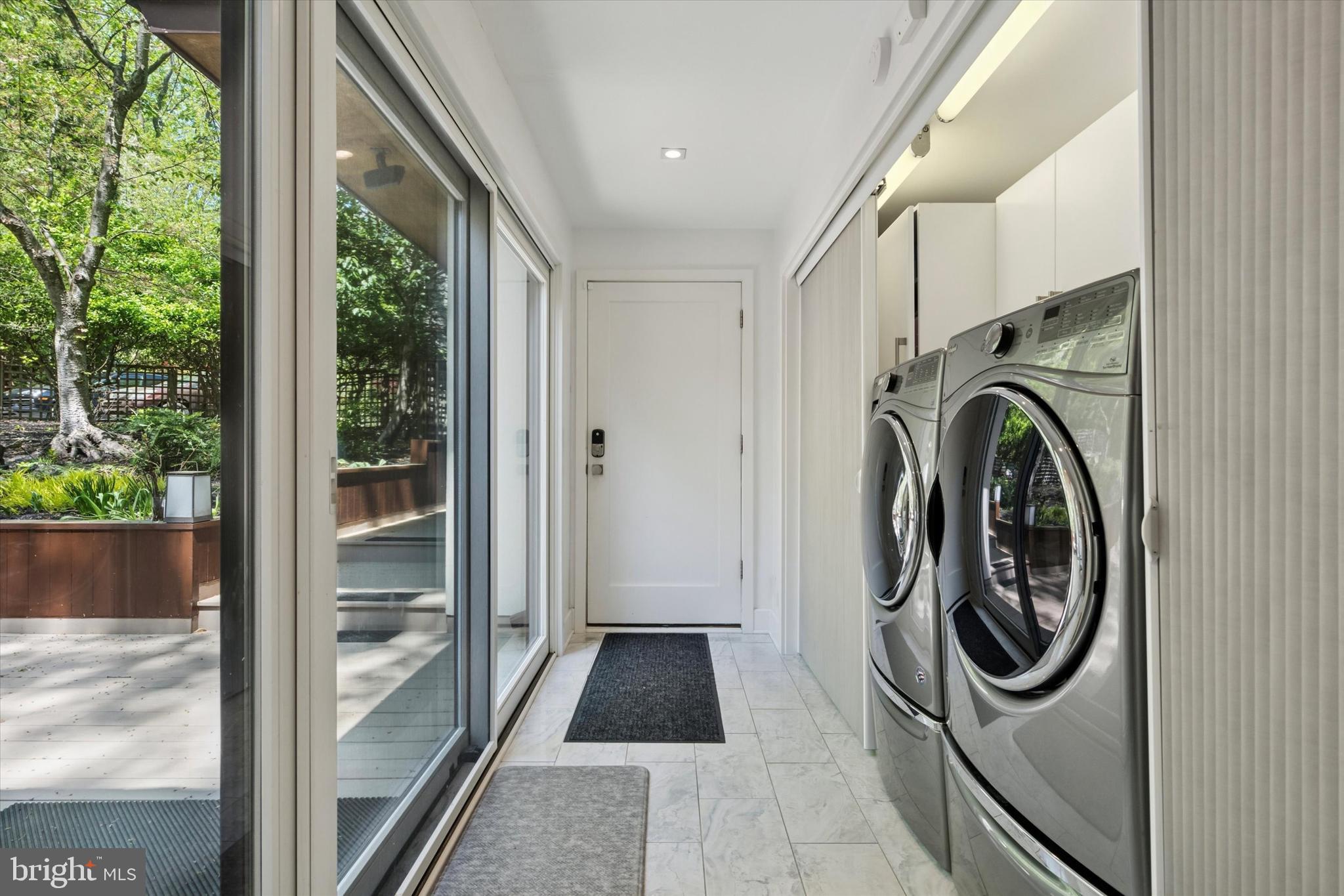4126 Apalogen Road Philadelphia, PA 19129 - Photo 53 of 75 a utility room with wooden floor washer and dryer