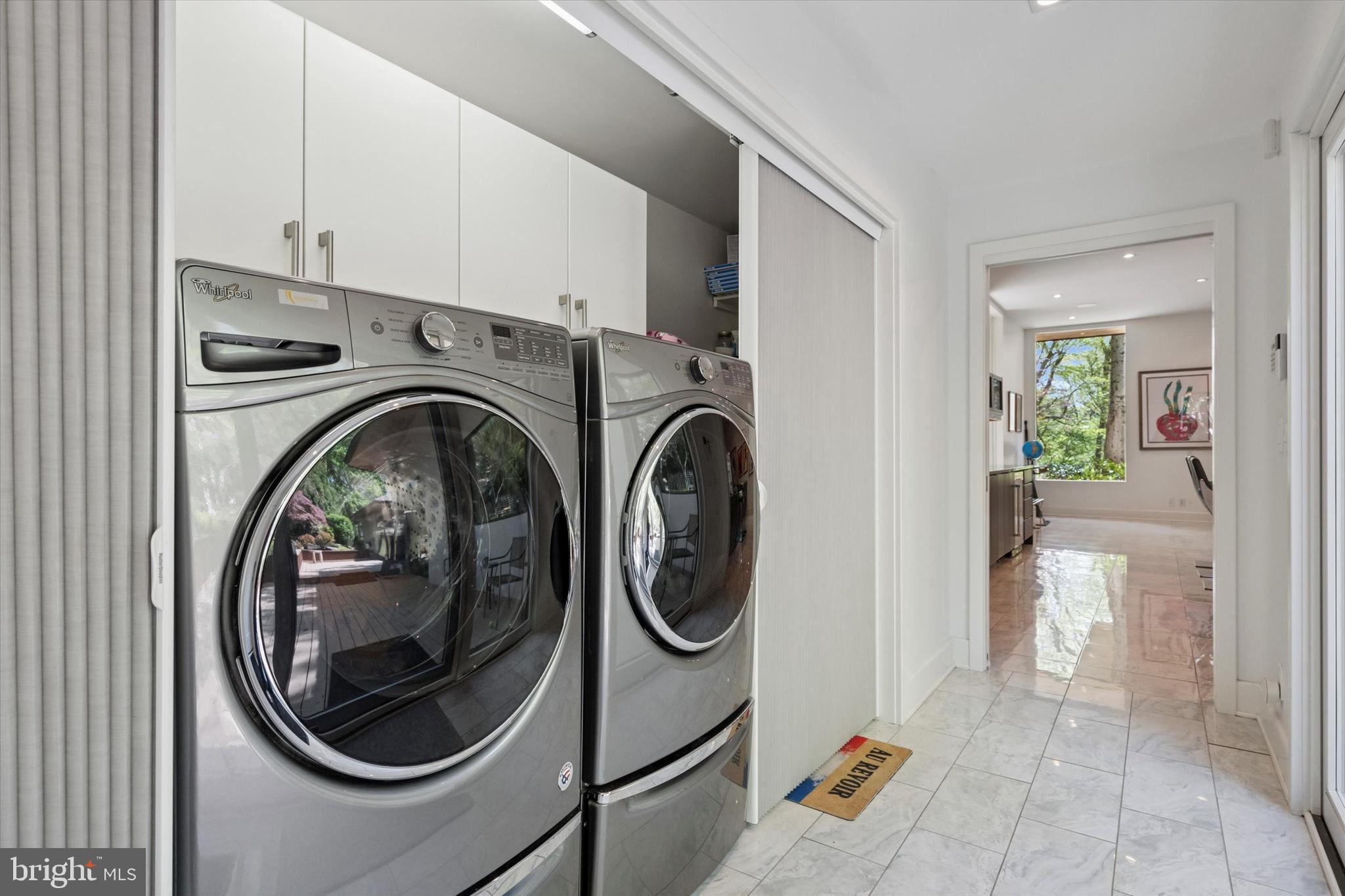 4126 Apalogen Road Philadelphia, PA 19129 - Photo 54 of 75 a utility room with dryer and washer
