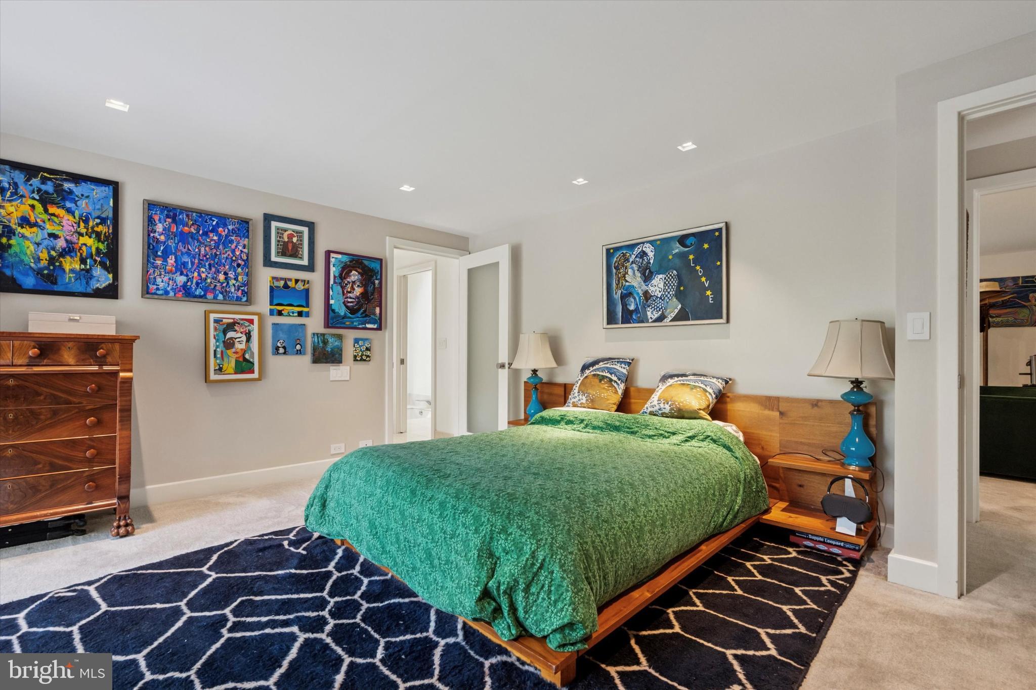 4126 Apalogen Road Philadelphia, PA 19129 - Photo 56 of 75 a bedroom with a bed and wooden floor