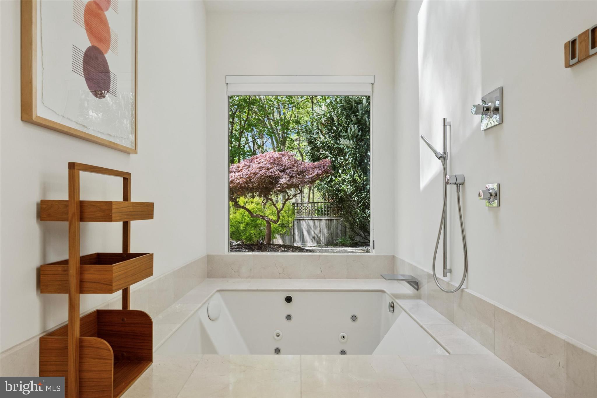 4126 Apalogen Road Philadelphia, PA 19129 - Photo 61 of 75 a bathroom with a bathtub and a window