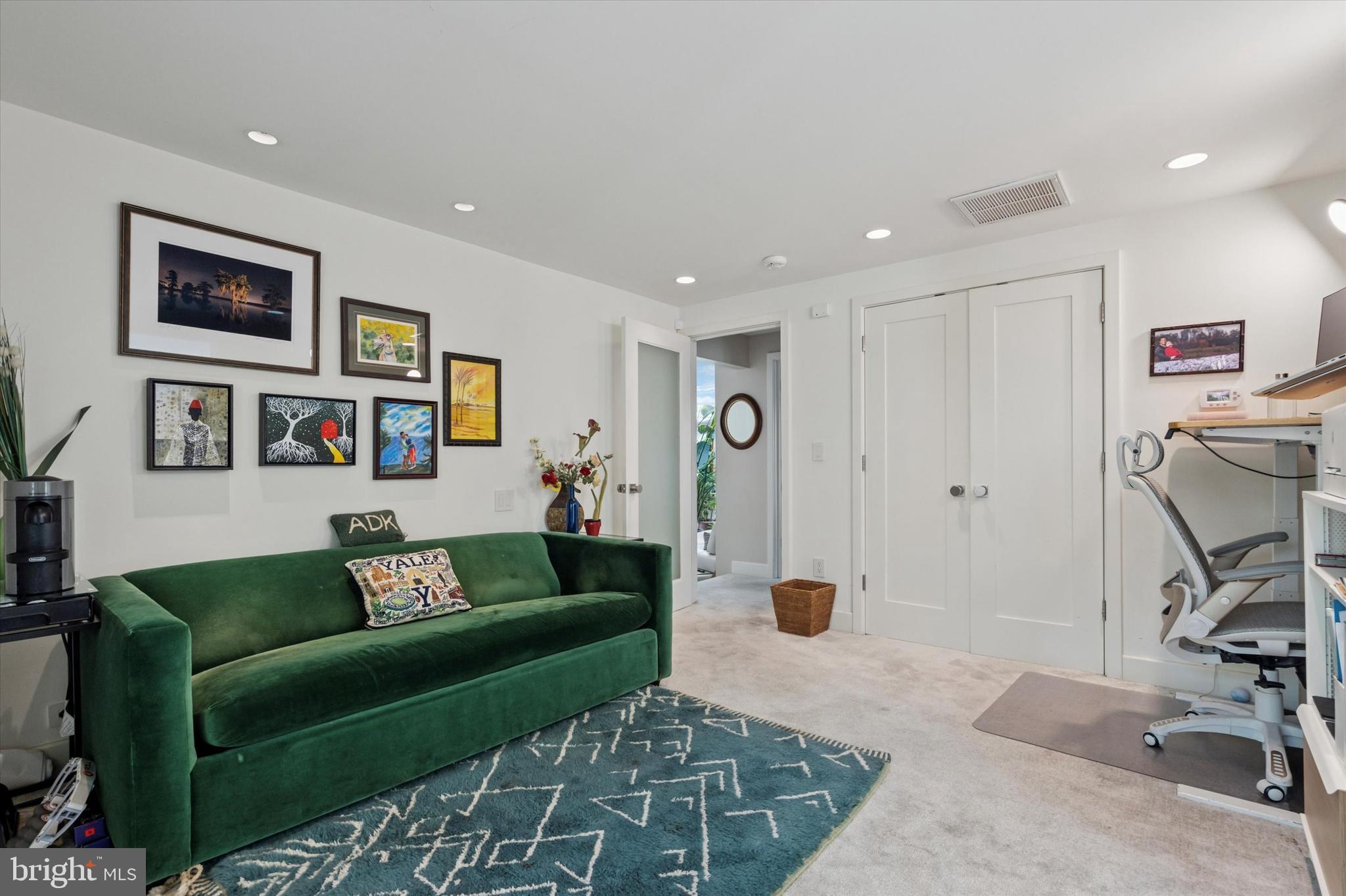 4126 Apalogen Road Philadelphia, PA 19129 - Photo 64 of 75 a living room with furniture and a rug