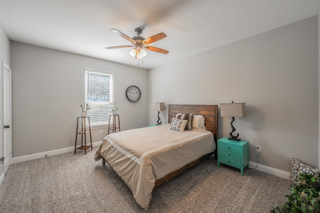117 Rock Salt Drive Springtown, TX 76082 - Photo 22 of 38 Carpeted room featuring a single window with blinds, a ceiling fan with light fixture, and light gray wall paint