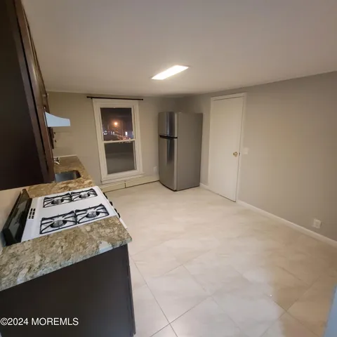 a view of an empty room and fire place