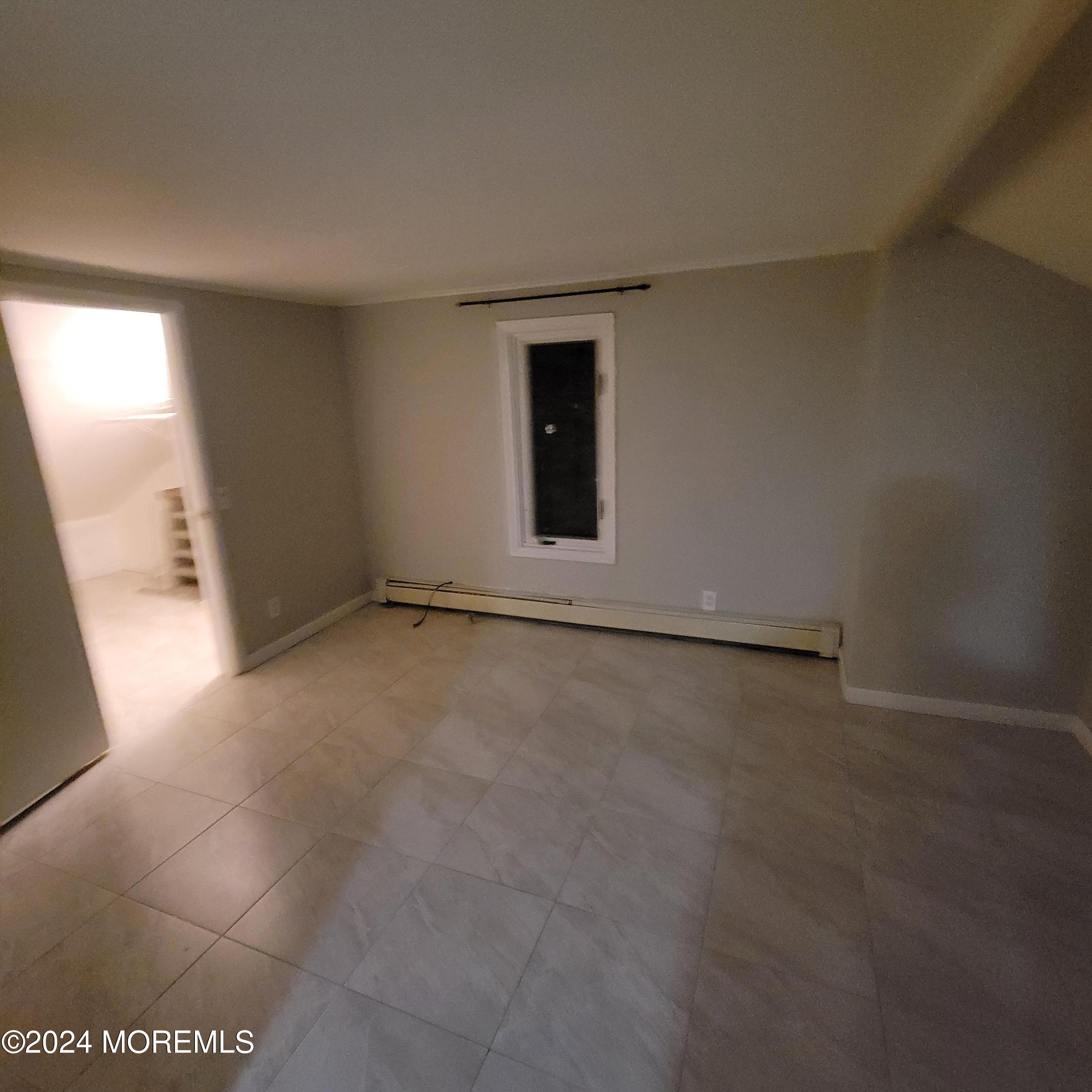 38 Main Street, Unit #5 Keyport, NJ 07735 - Photo 7 of 15 an empty room with windows