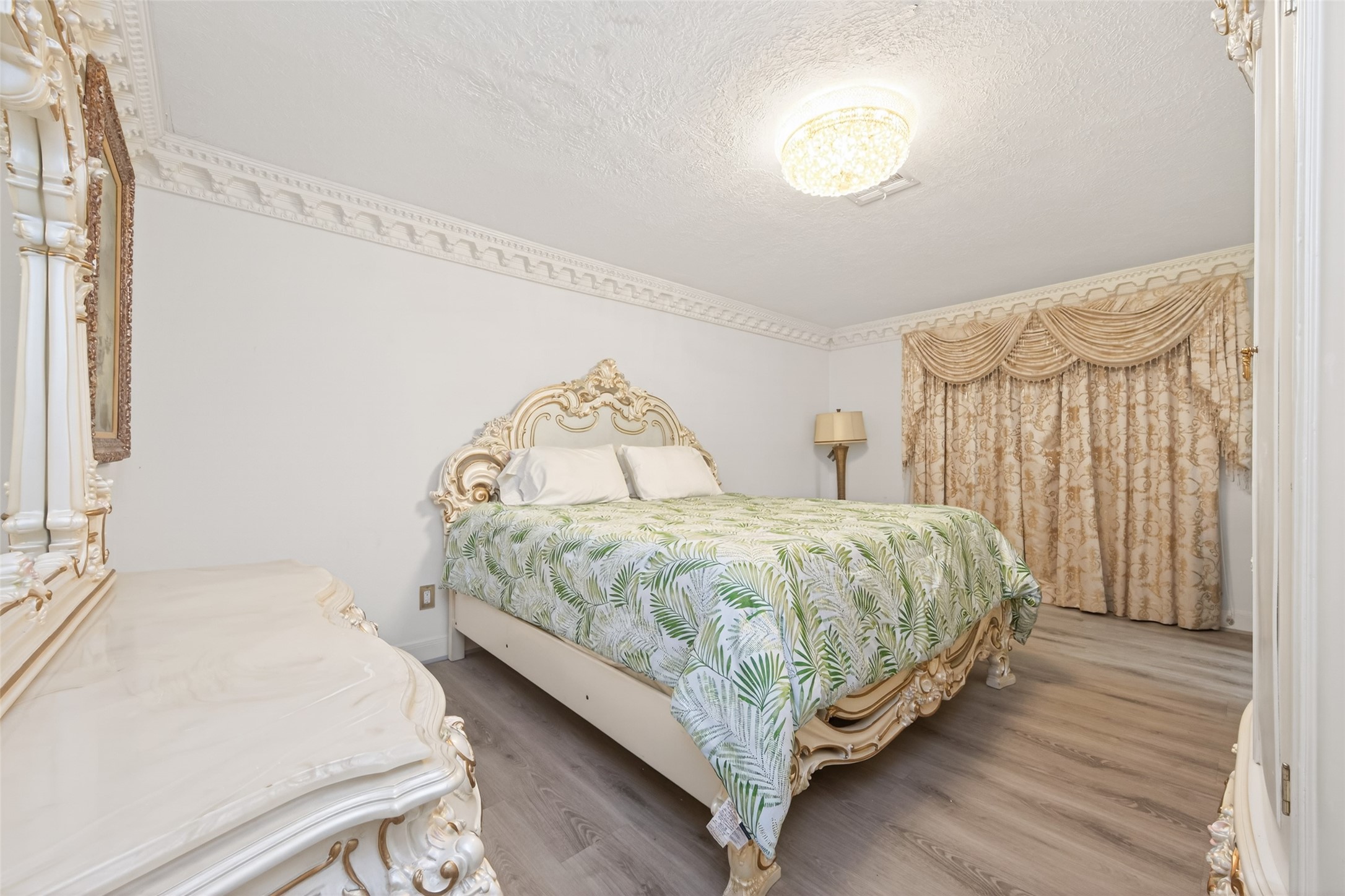 24 Windermere Lane Houston, TX 77063 - Photo 42 of 49 a bedroom with a bed and a night stand