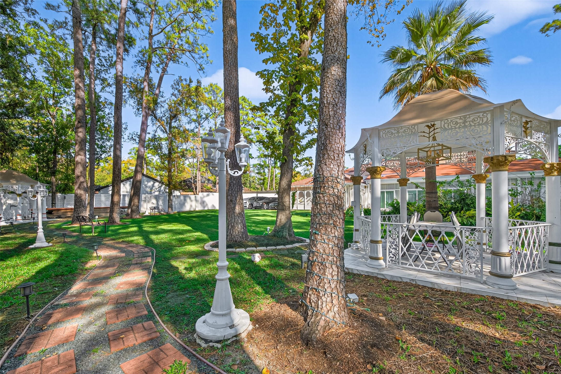 24 Windermere Lane Houston, TX 77063 - Photo 48 of 49 a view of a garden with a patio