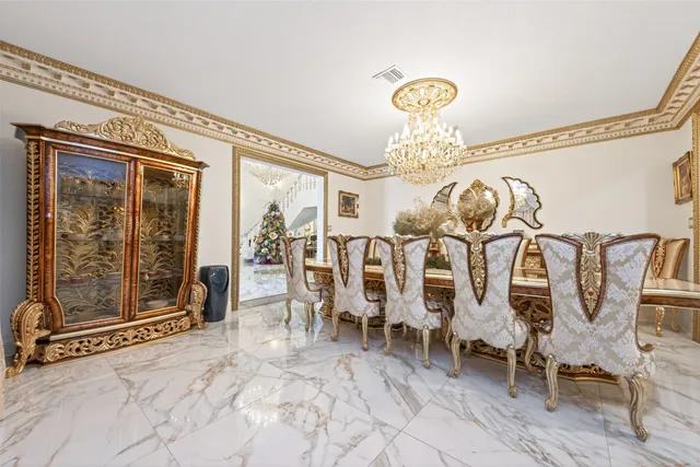 a view of a livingroom with furniture and chandelier