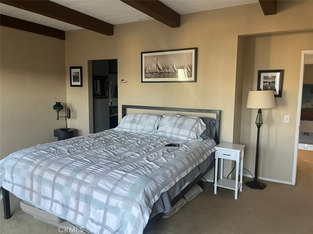 191 C. Mayor Redondo Beach, CA 90277 - Photo 11 of 20 a bedroom with a bed and wall painting