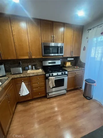 a view of a storage & utility room with wooden floor
