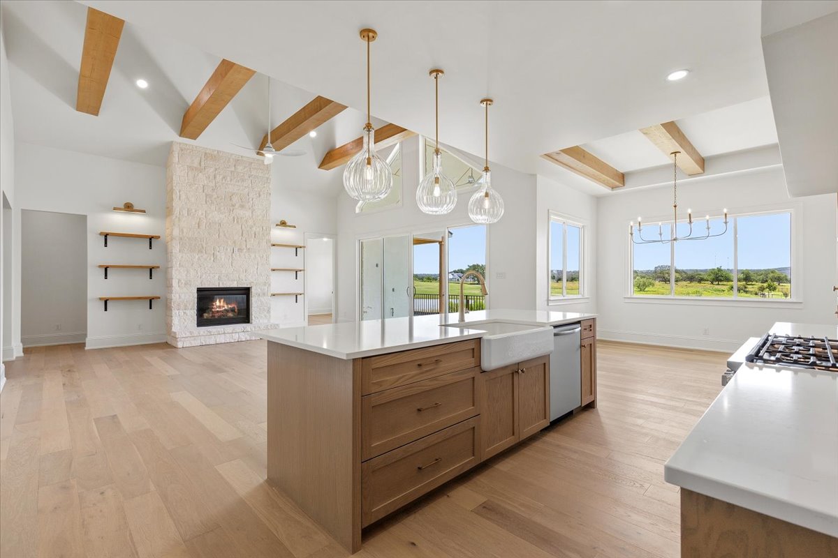 224 Sandia Loop Kingsland, TX 78639 - Photo 8 of 32 a large kitchen with kitchen island a large island in it