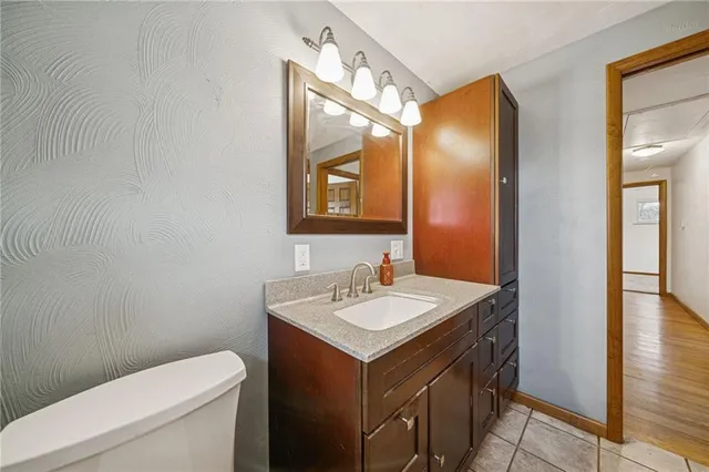 a bathroom with a sink and a toilet