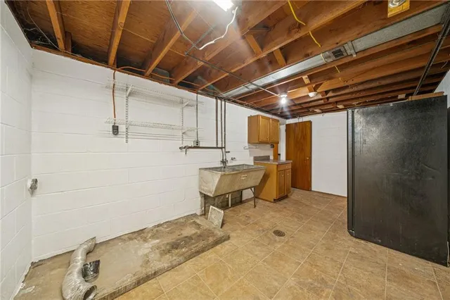 a view of a patio with a table and chairs under an umbrella