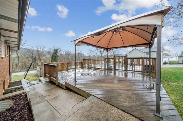 a view of a balcony with wooden floor