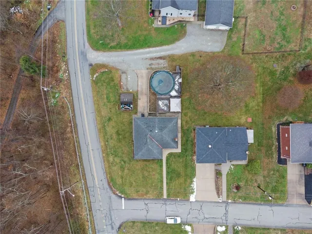 an aerial view of a house with a garden