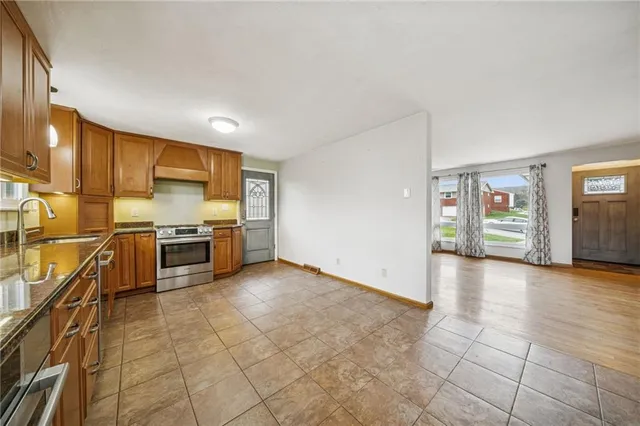 a view of a kitchen with a sink and cabinets