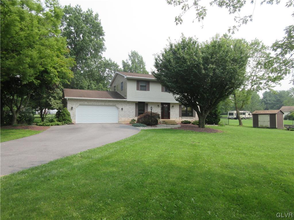 2139 Amlisa Road Nazareth, PA 18064 - Photo 1 of 35 a front view of a house with a garden