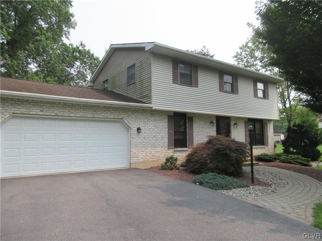 2139 Amlisa Road Nazareth, PA 18064 - Photo 12 of 35 a front view of a house with a yard and garage