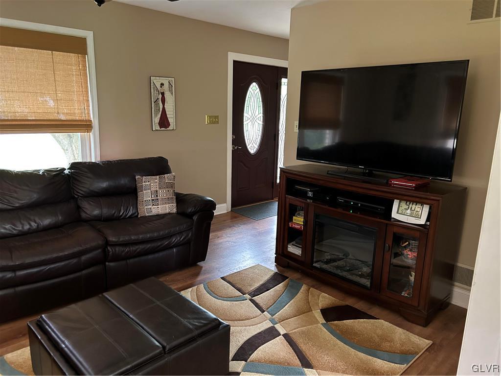 2139 Amlisa Road Nazareth, PA 18064 - Photo 14 of 35 a living room with furniture a flat screen tv and a fireplace