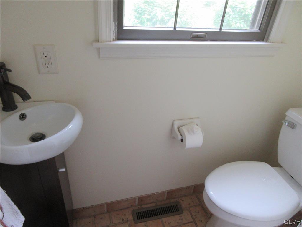 2139 Amlisa Road Nazareth, PA 18064 - Photo 21 of 35 a bathroom with a toilet a sink and mirror