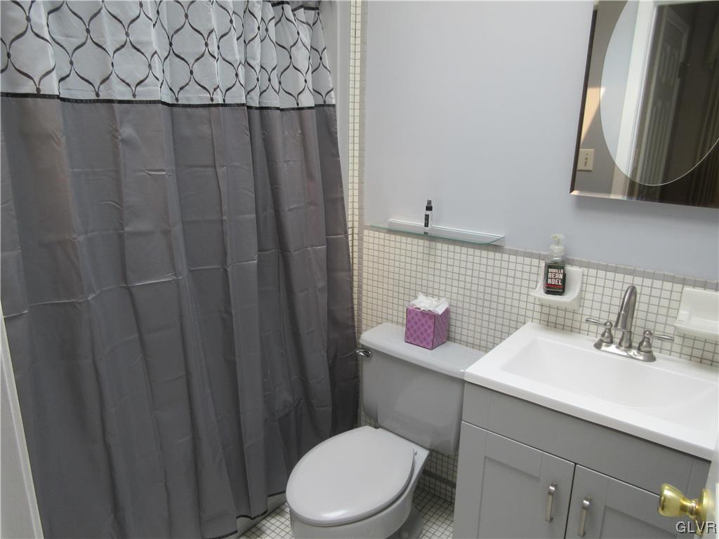 2139 Amlisa Road Nazareth, PA 18064 - Photo 25 of 35 a bathroom with a sink vanity mirror and toilet