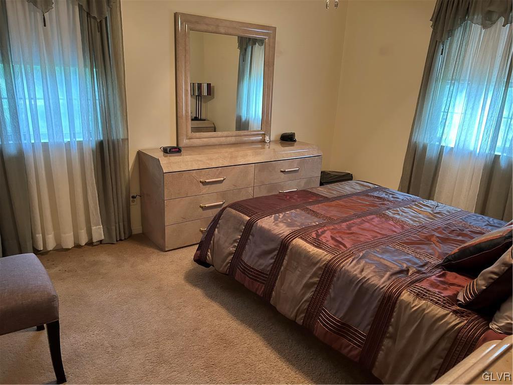 2139 Amlisa Road Nazareth, PA 18064 - Photo 29 of 35 a bedroom with a bed and a mirror