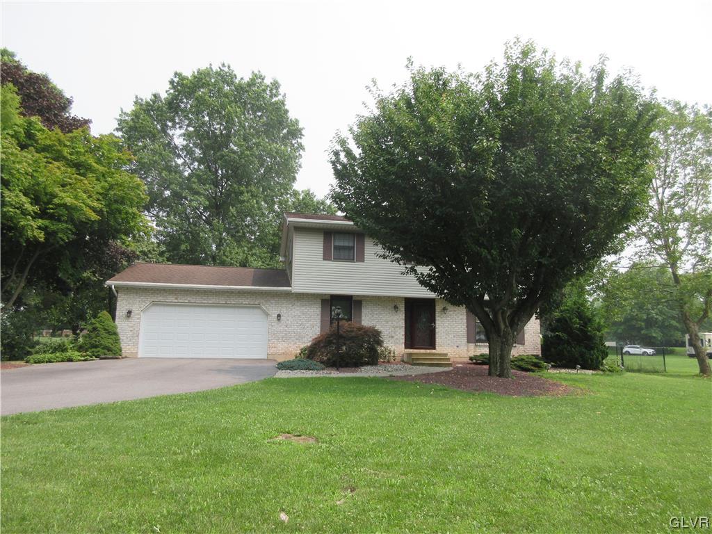 2139 Amlisa Road Nazareth, PA 18064 - Photo 3 of 35 a front view of a house with a yard and trees