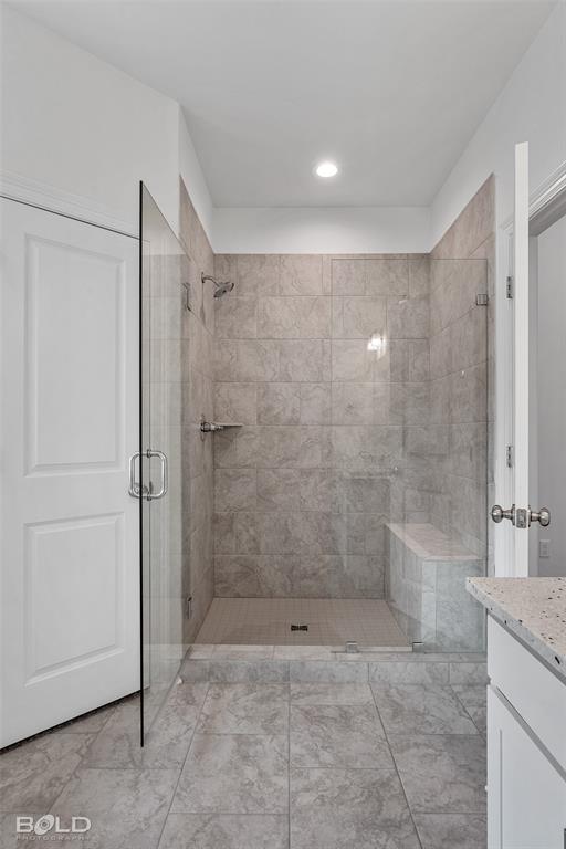 304 Prien Lk Loop Bossier City, LA 71111 - Photo 28 of 39 Spacious walk-in shower with clear glass enclosure and a built-in bench