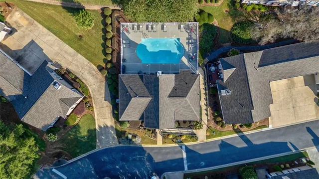 an aerial view of residential houses with outdoor space
