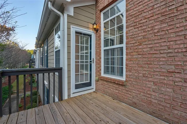 a view of a brick house with a large window