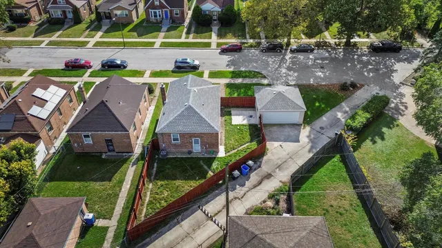 a aerial view of a house with a yard