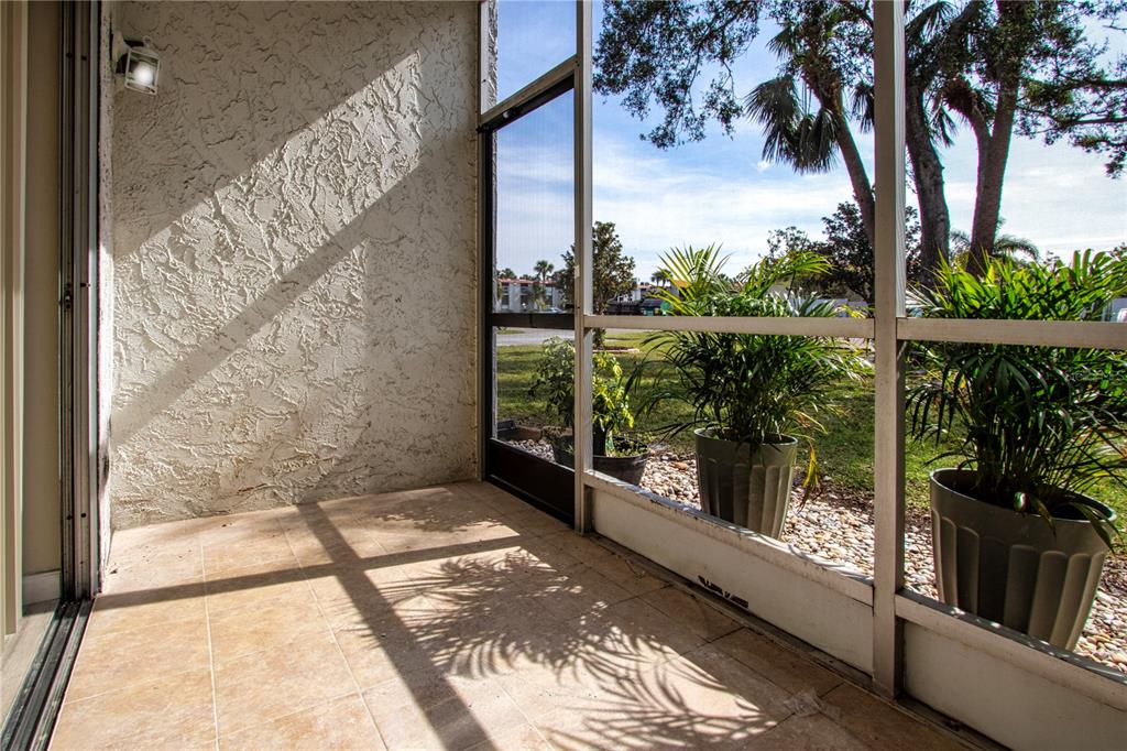 3259 South Beneva Road, Unit 102 Sarasota, FL 34232 - Photo 21 of 38 a view of a glass door with a yard from a balcony