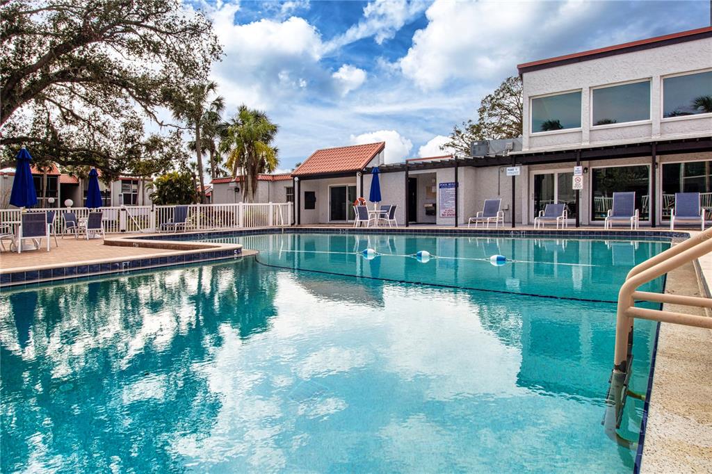 3259 South Beneva Road, Unit 102 Sarasota, FL 34232 - Photo 31 of 38 a view of a lake with a house in the background
