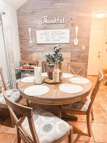 a dining room with table and chairs