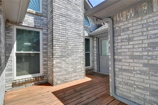 a view of a door of a house with wooden floor