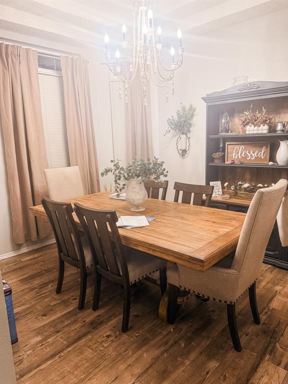 6102 Tacoma Street Rowlett, TX 75089 - Photo 5 of 16 a dining room with furniture and wooden floor