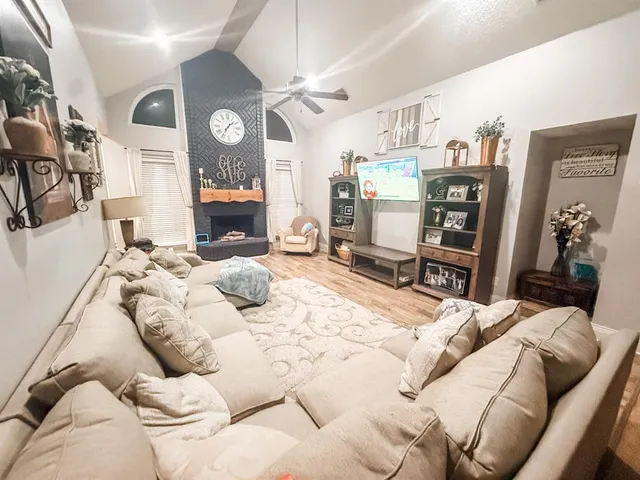 a bedroom with a bed window and couch