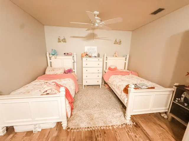 a bedroom with a bed and a cabinets